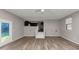 View of the living room with wood flooring, access to kitchen and outdoor patio at 4332 N Hickory Ln, Douglasville, GA 30134