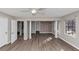 Spacious living room featuring wood flooring, stone accent wall, and natural light at 4332 N Hickory Ln, Douglasville, GA 30134
