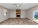 Spacious living room featuring wood flooring and a stone fireplace at 4332 N Hickory Ln, Douglasville, GA 30134