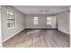 Living room filled with natural light showcasing new wood floors and neutral paint at 4332 N Hickory Ln, Douglasville, GA 30134