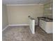 Small bar featuring a sink, cabinetry and mirrored backsplash at 4520 Mossey Dr, Lithonia, GA 30038