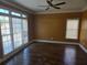 Spacious bedroom featuring hardwood floors, crown molding, and plentiful natural light at 4520 Mossey Dr, Lithonia, GA 30038