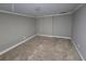 Neutral bedroom featuring trim and carpet at 4520 Mossey Dr, Lithonia, GA 30038