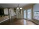 View of the breakfast nook featuring french doors, arched entry, and hardwood floors at 4520 Mossey Dr, Lithonia, GA 30038