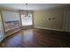 Breakfast nook with lots of windows and hardwood floors at 4520 Mossey Dr, Lithonia, GA 30038