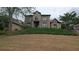 Exterior view of this two-story home shows the landscaped yard and traditional architecture at 4520 Mossey Dr, Lithonia, GA 30038