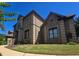An additional side view shows manicured lawn and detailed stonework at 4520 Mossey Dr, Lithonia, GA 30038
