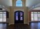 Bright entryway featuring double doors, hardwood floors, transom window and sidelight windows at 4520 Mossey Dr, Lithonia, GA 30038