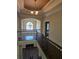 An open foyer featuring wood floors and iron stair railings with abundant natural light at 4520 Mossey Dr, Lithonia, GA 30038