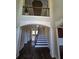 Grand foyer with soaring ceilings and elegant staircase at 4520 Mossey Dr, Lithonia, GA 30038