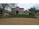 Exterior view of this two-story home shows the landscaped yard and traditional architecture at 4520 Mossey Dr, Lithonia, GA 30038
