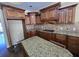 Kitchen featuring wood cabinets, granite countertops, tile backsplash and center island at 4520 Mossey Dr, Lithonia, GA 30038
