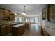 Kitchen featuring an island, wood floors, cabinetry and granite countertops at 4520 Mossey Dr, Lithonia, GA 30038