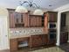Well-equipped kitchen featuring dark cabinets, granite counters, and stainless-steel appliances at 4520 Mossey Dr, Lithonia, GA 30038