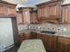 Beautiful kitchen featuring wood cabinets, granite countertops, tile backsplash and center island at 4520 Mossey Dr, Lithonia, GA 30038