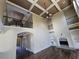 Grand living room featuring high ceilings, balconies, a fireplace and built-in shelves at 4520 Mossey Dr, Lithonia, GA 30038