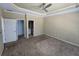 A large primary bedroom featuring a ceiling fan, en suite bathroom and walk-in closet at 4520 Mossey Dr, Lithonia, GA 30038