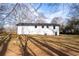 Spacious backyard with bright sunshine, mature trees and lawn at 4776 Ballew Dr, Powder Springs, GA 30127