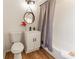 Cozy bathroom with sleek vanity, stylish mirror, and a shower-tub combination with a curtain at 4776 Ballew Dr, Powder Springs, GA 30127