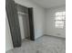 Spacious bedroom with soft carpet, a window with backyard view and ample closet space at 4776 Ballew Dr, Powder Springs, GA 30127