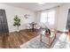 Bright dining area with hardwood floors, modern decor, and comfortable seating at 4776 Ballew Dr, Powder Springs, GA 30127