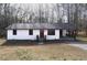 Charming single story home with a front porch and mature trees at 4776 Ballew Dr, Powder Springs, GA 30127