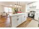Well-lit modern kitchen with stainless steel appliances and a large island with barstool seating at 4776 Ballew Dr, Powder Springs, GA 30127