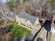 Aerial view of the property displaying its well-manicured lawn and long driveway at 5956 Henley Dr, Powder Springs, GA 30127