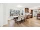 Dining Area featuring large windows, hardwood floors, and modern finishes at 5956 Henley Dr, Powder Springs, GA 30127