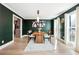 Dining room featuring modern light fixture, decorative rug, and contemporary decor at 5956 Henley Dr, Powder Springs, GA 30127