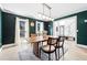 Dining room featuring modern light fixture, decorative rug, and contemporary decor at 5956 Henley Dr, Powder Springs, GA 30127