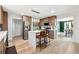 Kitchen featuring stainless steel appliances, central island, breakfast bar, and wood floors at 5956 Henley Dr, Powder Springs, GA 30127