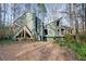 A distinctive modern home featuring unique angles and architectural details in a wooded setting at 1793 Shelley Ne Ct, Marietta, GA 30062