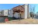 View of back deck on house showing the yard, house, and sliding glass door at 6138 Raleigh Oaks Ct, Lithonia, GA 30058