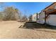 View of the home's backyard, showing the back of the house at 6138 Raleigh Oaks Ct, Lithonia, GA 30058