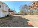 Spacious backyard featuring a wooden deck and a privacy fence, perfect for outdoor activities at 6138 Raleigh Oaks Ct, Lithonia, GA 30058