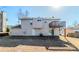 Back exterior of house with a small, elevated deck overlooking the backyard at 6138 Raleigh Oaks Ct, Lithonia, GA 30058