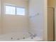 Bathroom featuring a soaking tub with jets and a glass-enclosed shower at 6138 Raleigh Oaks Ct, Lithonia, GA 30058
