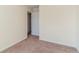 Bedroom with neutral carpeting and an entrance to a hallway at 6138 Raleigh Oaks Ct, Lithonia, GA 30058