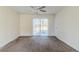 Bedroom with a ceiling fan and sliding door leading to the backyard at 6138 Raleigh Oaks Ct, Lithonia, GA 30058