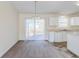 Dining area with carpet, sliding glass door, and adjacent to the kitchen at 6138 Raleigh Oaks Ct, Lithonia, GA 30058