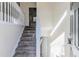 Entryway with carpeted stairs leading up and a bright, open space with ample natural light at 6138 Raleigh Oaks Ct, Lithonia, GA 30058