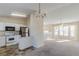 Open concept kitchen with white appliances and adjacent living area at 6138 Raleigh Oaks Ct, Lithonia, GA 30058