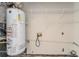 Water heater and shelving in a utility closet, offering practical storage solutions at 6138 Raleigh Oaks Ct, Lithonia, GA 30058