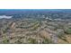 An aerial view of the golf course, the lake, and tree-lined neighborhoods at 616 Redwood Ln, Canton, GA 30114