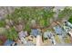 An aerial view reveals the property's setting among lush trees and landscaping at 616 Redwood Ln, Canton, GA 30114