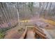 Discover this expansive backyard with wooden stairs and a beautiful fenced perimeter, offering privacy and a lush woodland view at 616 Redwood Ln, Canton, GA 30114