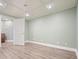 Finished basement offers a versatile space with wood-look flooring, recessed lights, and neutral paint colors at 616 Redwood Ln, Canton, GA 30114