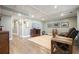 Well-lit basement featuring a cozy entertainment area and views into unfinished storage area at 616 Redwood Ln, Canton, GA 30114