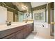 Bathroom featuring double sinks, tub, and shower, providing a luxurious experience at 616 Redwood Ln, Canton, GA 30114